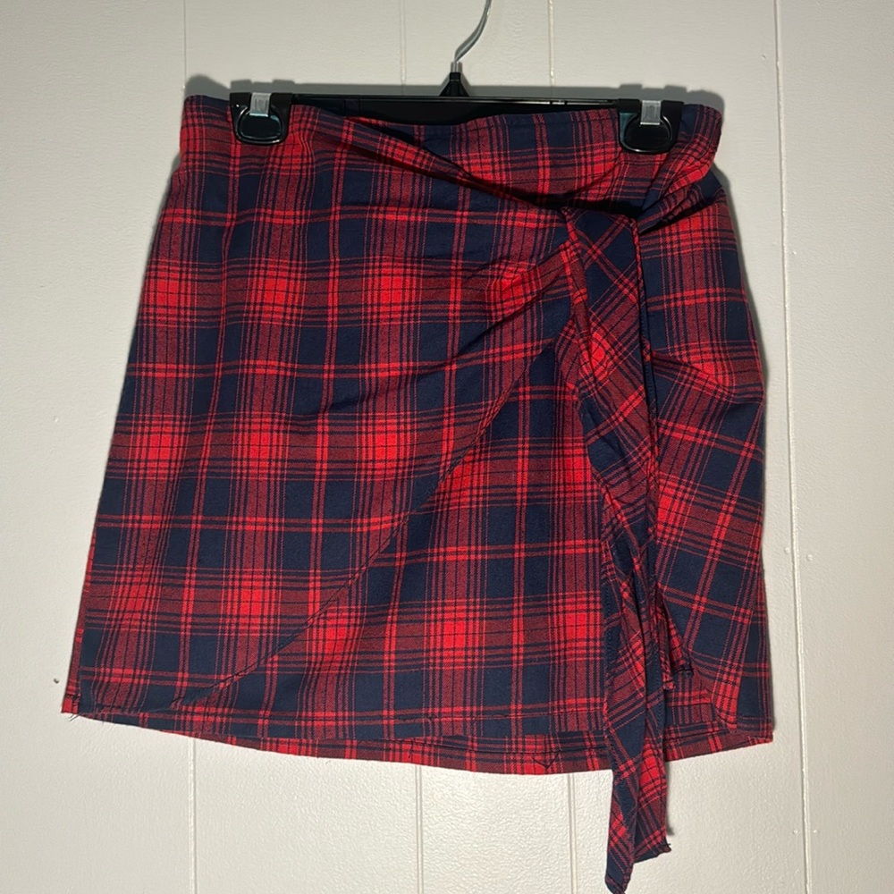 Blue and red plain skirt. Faux wrap tie. 14 inch flat waistband 16 inches long